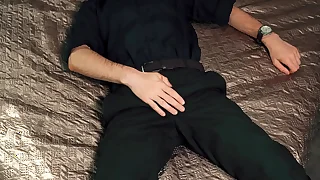 Young handsome man Noel Dero masturbates on the bed in a beautiful suit and brings himself to orgasm